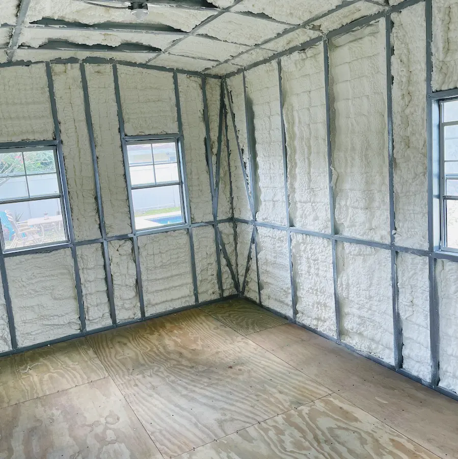 Closed-cell spray foam insulation applied to wall cavities in a residential project in Stanford